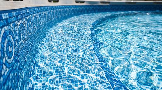 Close-up of a blue patterned above-ground pool liner and clear water