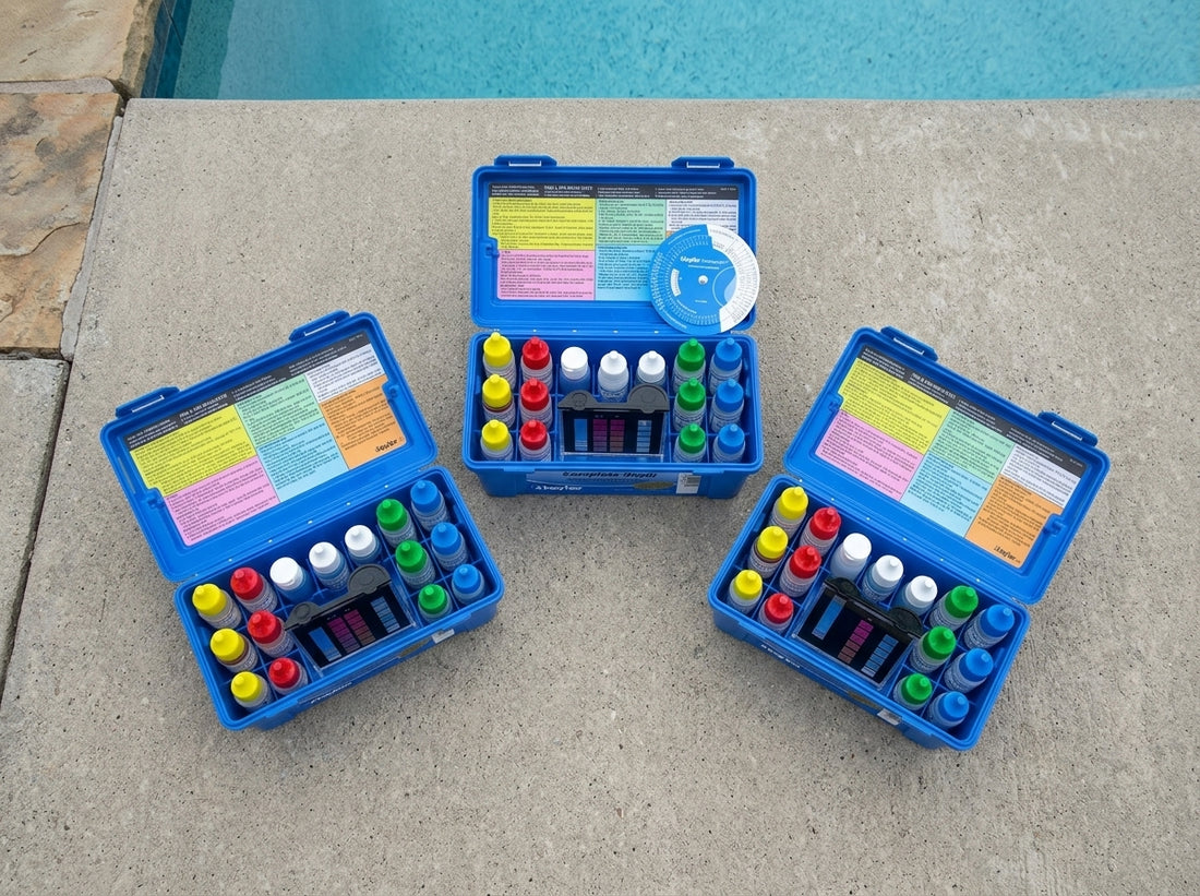 Three Taylor pool water test kits arranged on a poolside deck