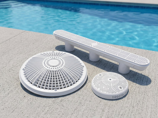 VGB-compliant pool drain covers on a daylight pool deck